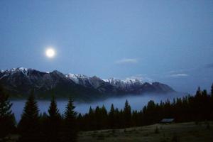 A stunning moonrise over the Canadian Rockies.