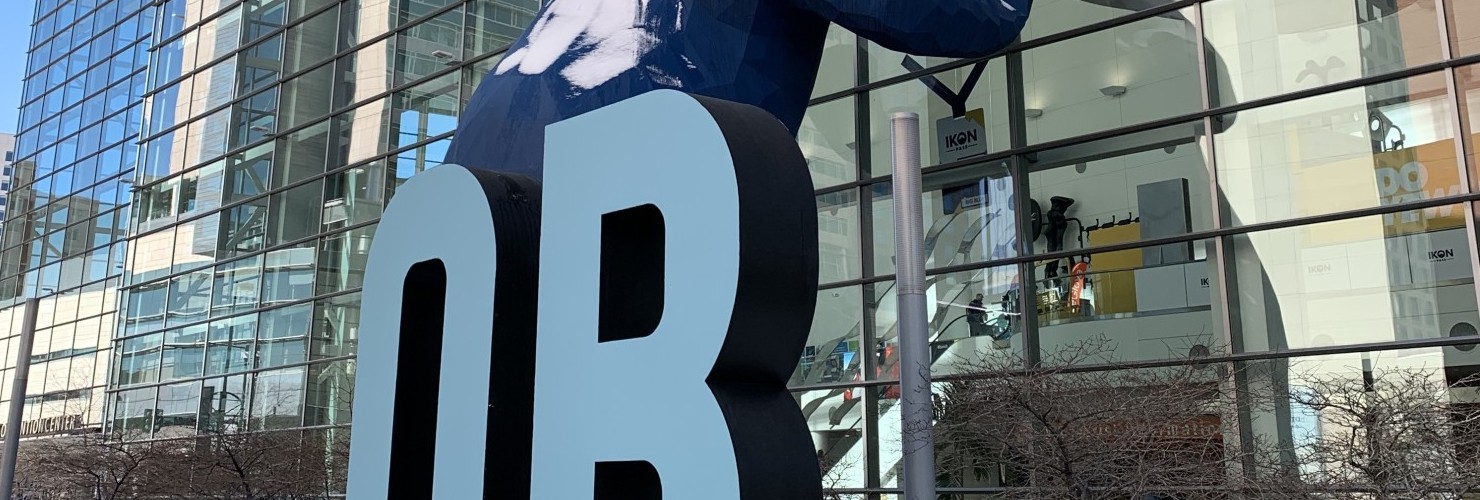 blue bear with Outdoor Retailer sign in front of Denver Convention Center