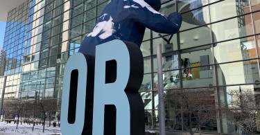 blue bear with Outdoor Retailer sign in front of Denver Convention Center