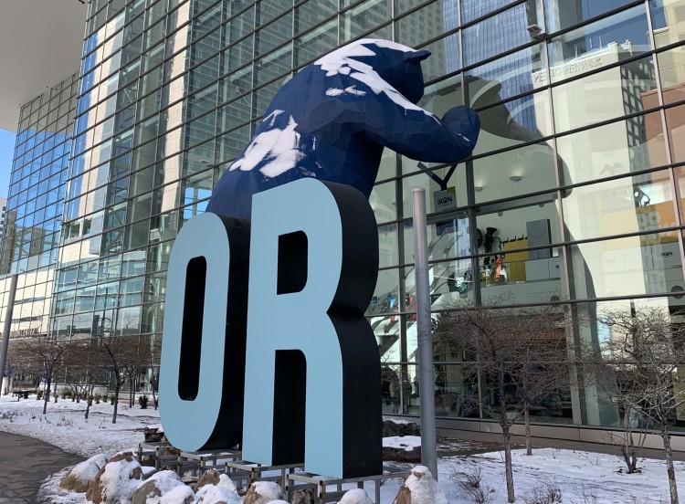 blue bear with Outdoor Retailer sign in front of Denver Convention Center