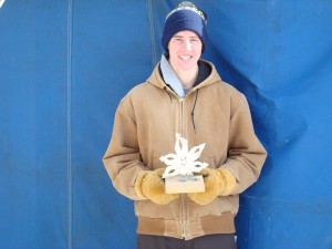 Jeffrey Quednow holding his Snowflake trophy