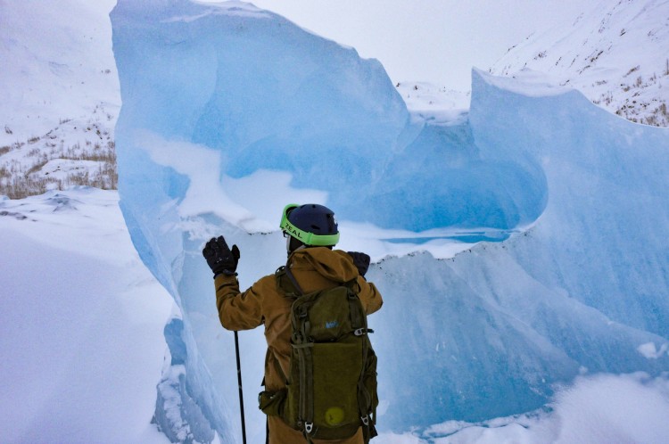 dying glacier: man looking out from top of Portage Glacier 