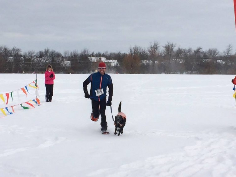 Brad Zoller with his training partner, Senna, last year in Barrington, IL for the Frozen Zucchini 5k snowshoe race.