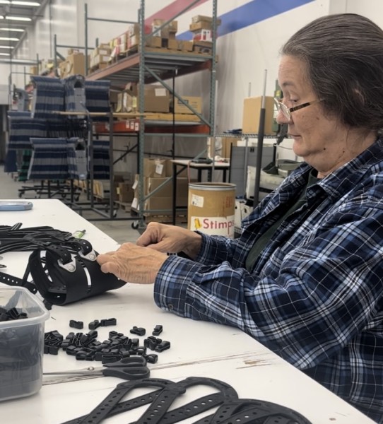 woman assembling a snowshoe