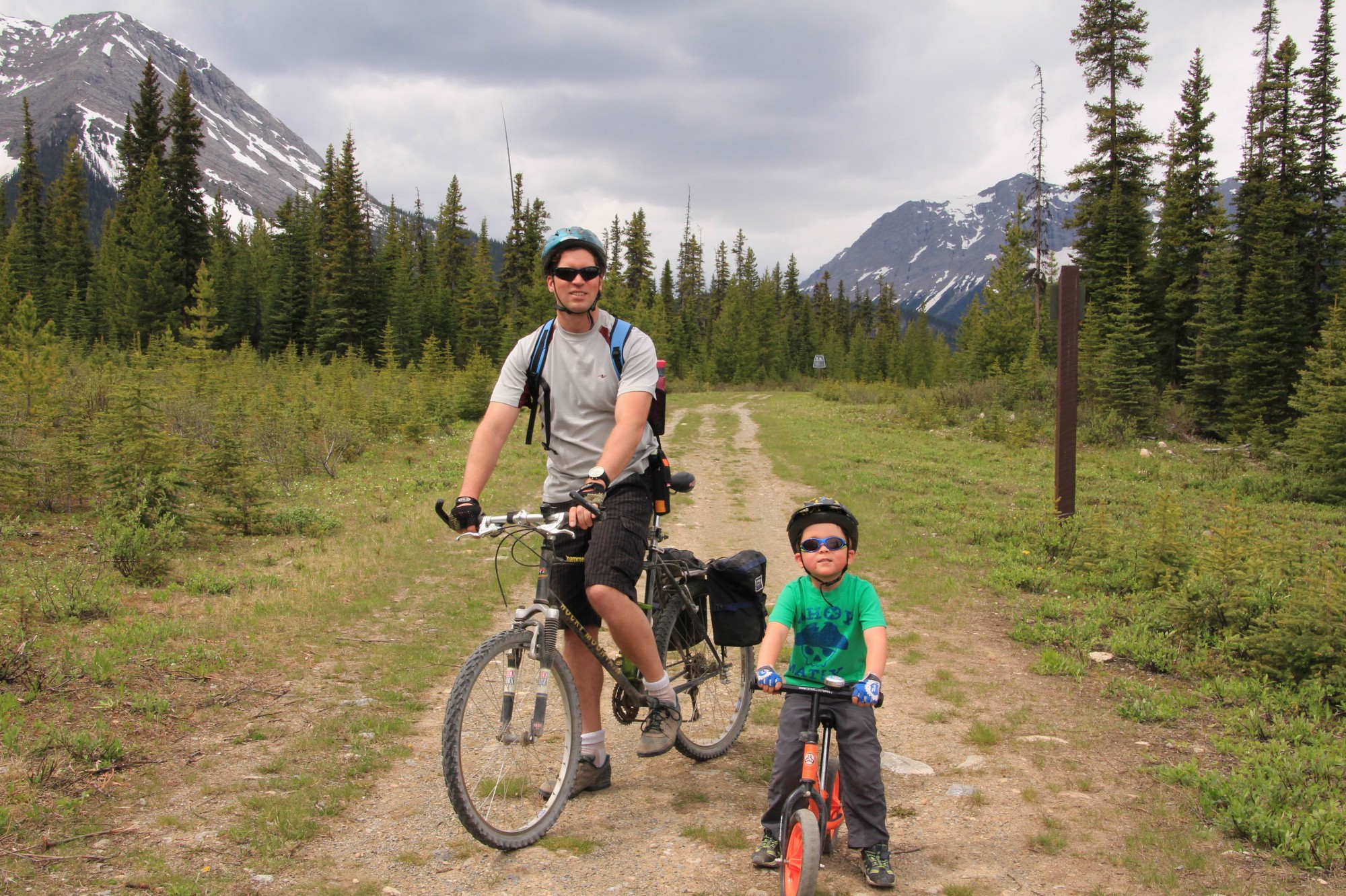son and dad posed for a photo while biking to Watridge Lake