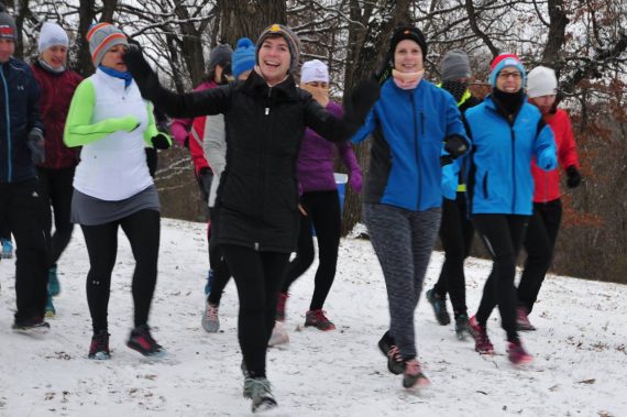 trail runners on snowy trail- Ritter Farm Trail Races