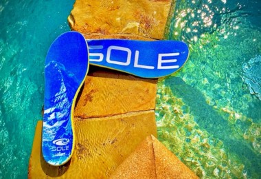 SOLE footbeds sitting on rock near pool