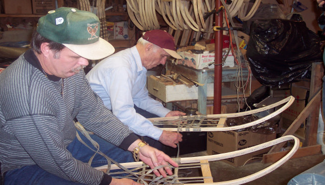 Brian and Edmond Theriault making wooden snowshoes