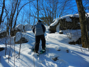 Snowshoeing up steep slopes and over large boulders is typical on Rib Mountain