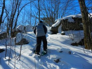 Snowshoeing up steep slopes and over large boulders is typical of Rib Mountain