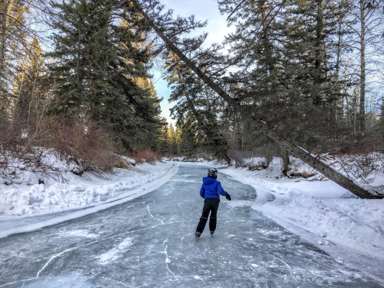 outdoor winter activities idea: woman ice skating in a park