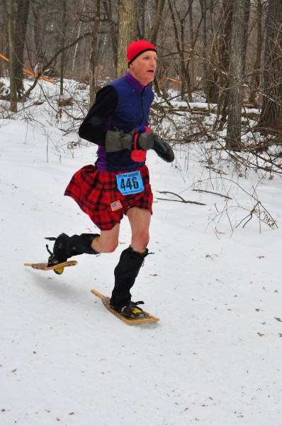 Dave Sykora racing the USSSA National Championships wearing modern wooden snowshoes.