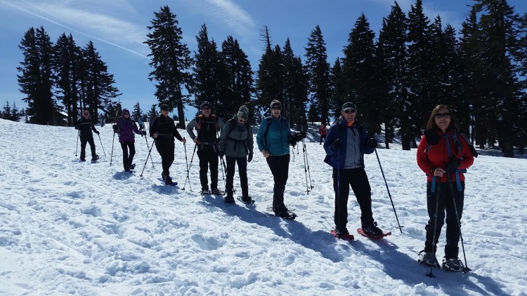 group of snowshoers on tour pose for a photo, southern OR