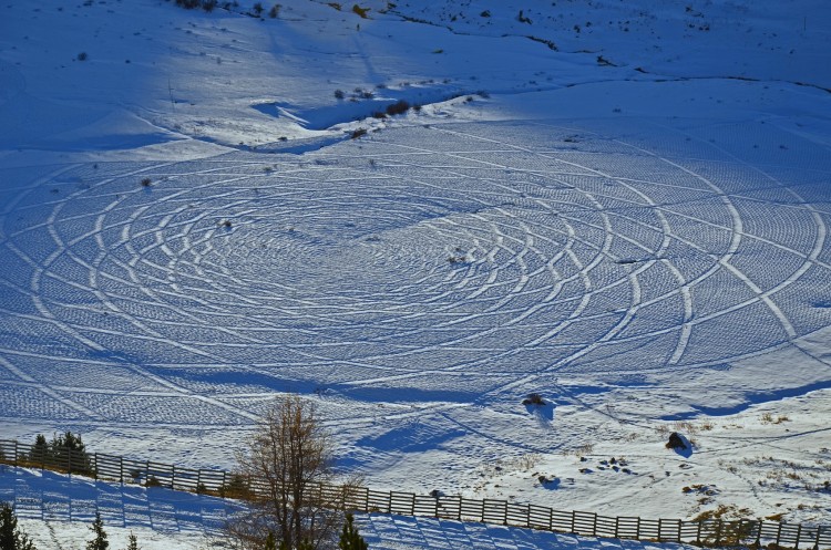 view from above of waterbowl geometric art by snow artist, Simon Beck