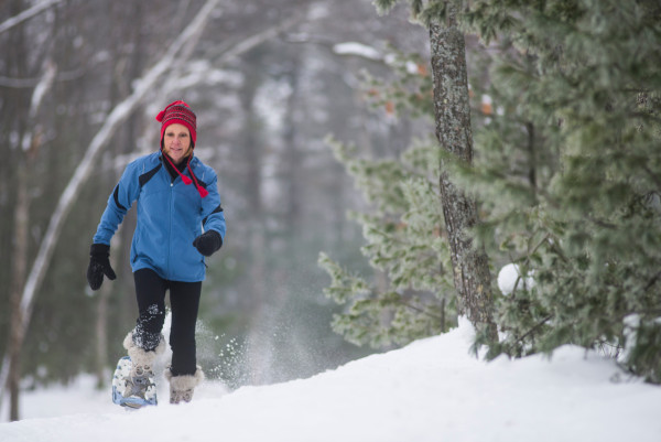 Woman snowshoeing in St. Germain