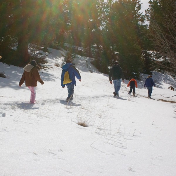 people on a winter hike surrounded by snow