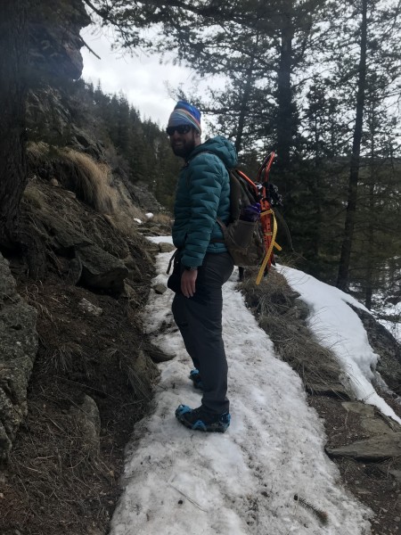 man standing on icy trail with Yaktrax