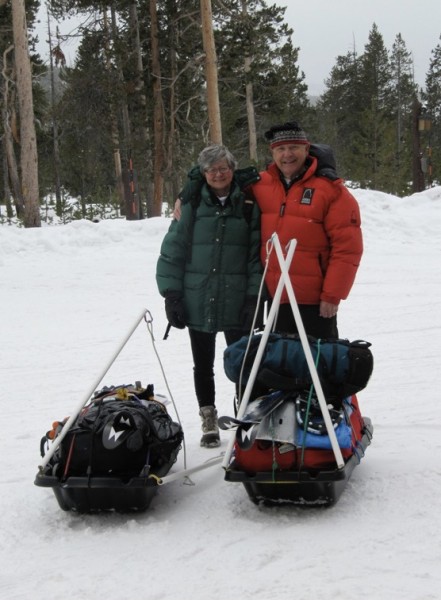 Stan and Margaret in front of their two sleds in Yellowstone