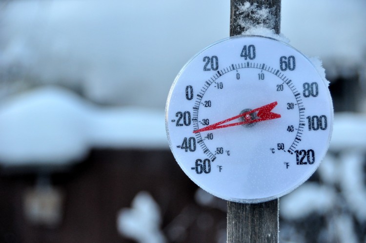 close up of temperature gauge with freezing temperatures