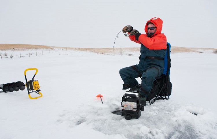 man fishing in winter