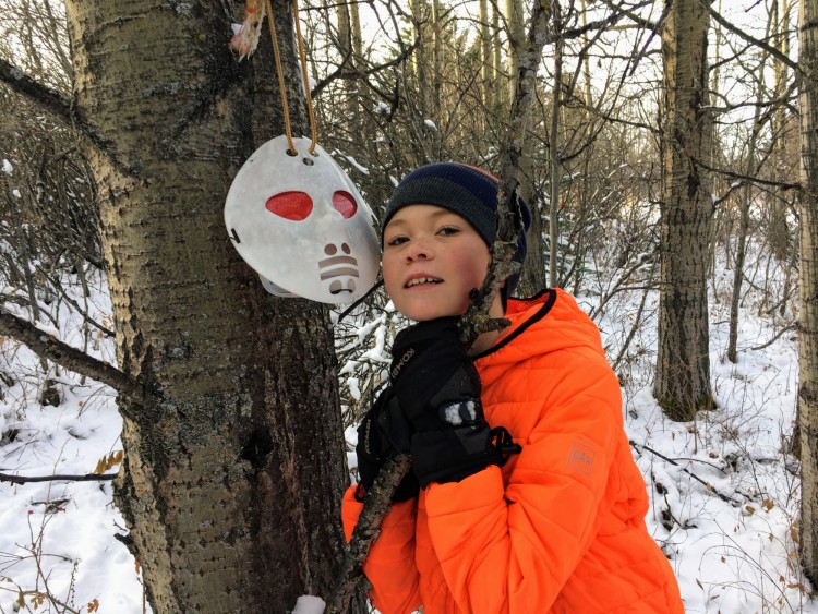 outdoor winter activities ideas: boy near geocaching mask