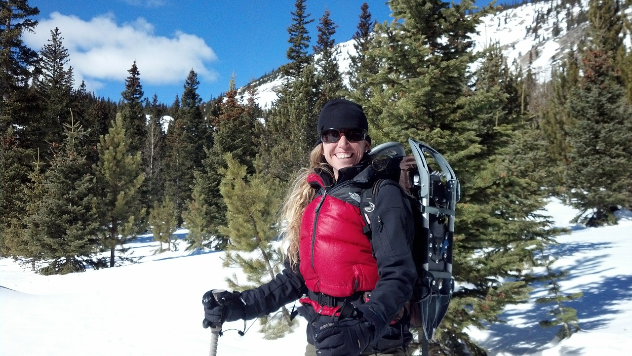 woman smiling on winter hike