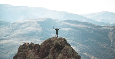 hiker on top of a mountain