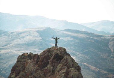 hiker on top of a mountain