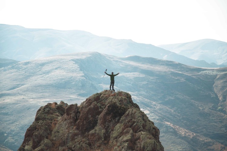 hiker on top of a mountain