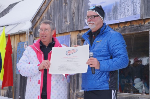 Jim Tucker (L), Athletic Director of Paul Smith's College, receives the honor of the 2014 Cindy Brochman Snowshoe Person of the Year from USSSA Sports Director, Mark Elmore