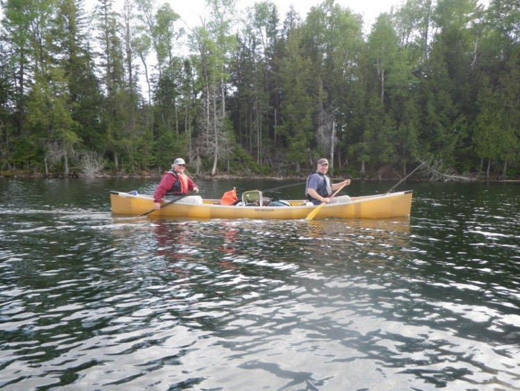 two men in canoe on Whitefish Lake