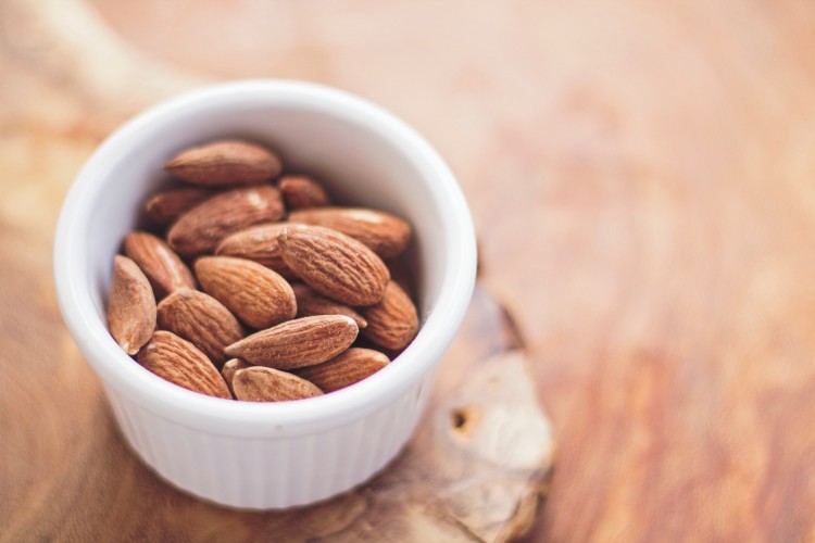 snowshoeing tips for snacks: almonds in a small cup