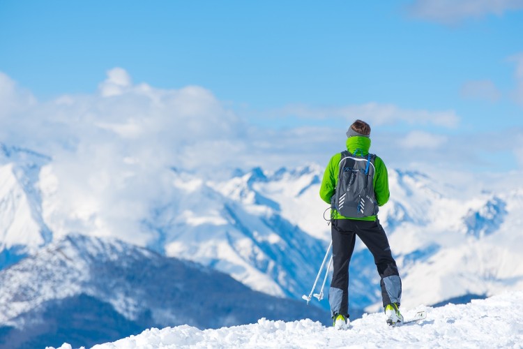 person standing on top of snowy mountain