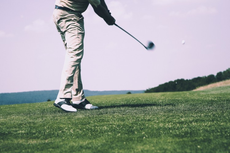 close up of person in golf swing