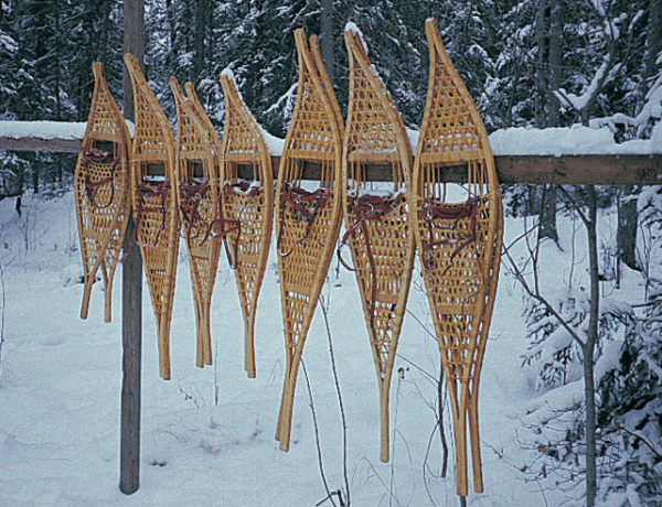 traditional snowshoers hanging on a fencepost