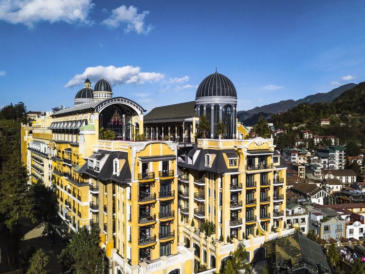 large hotel with blue sky in background