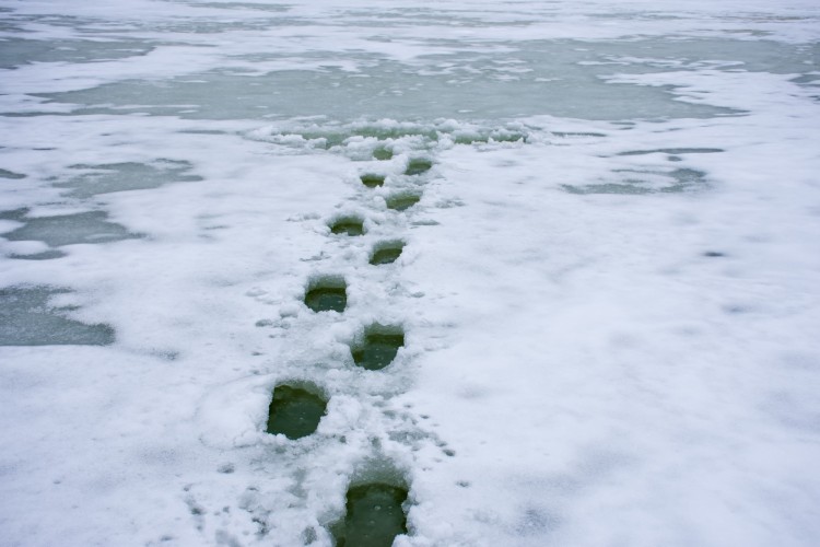 footsteps in snow with fall through ice