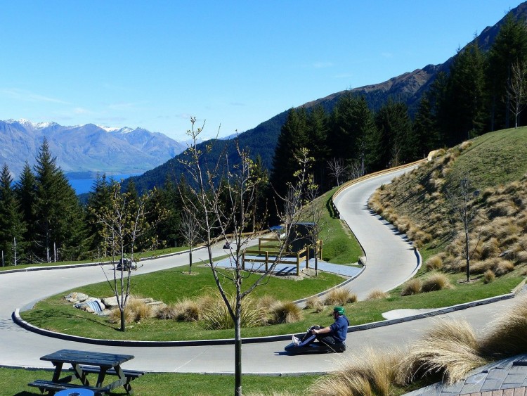 new sports to try: luge track in summer with mountains in background