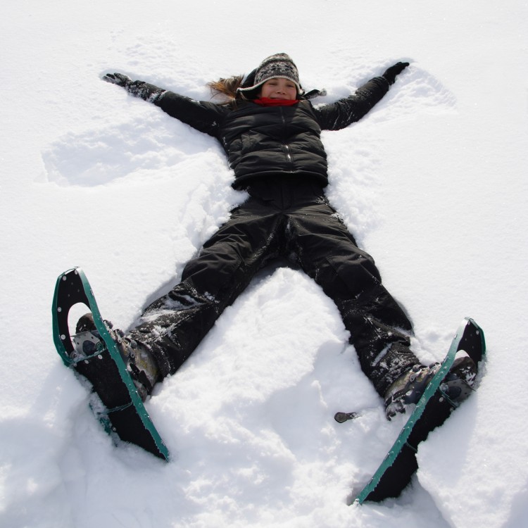 woman laying in snow