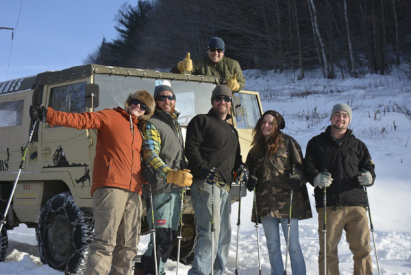 Backcountry snowshoers celebrate the end of an exhilarating hike, and look forward to the off-road trip back to town.