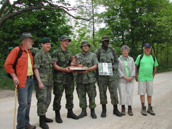 Here representatives of the club and the regiment pose on the bridge, which was completed last fall.