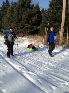 Co-RD Chris Scotch (R) and Nathan Jackson demonstrate 2 ways to carry the required load. The sled is most popular (photo courtesy FB Helen Lavin)