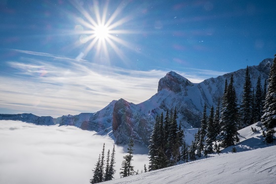 sun shining over mountain, snowshoeing avalanche safety