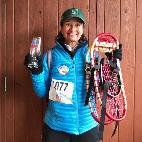 Judy Holmes with Maine Guide Snowshoes after 1st place win, Beaver Creek Running Series 2018