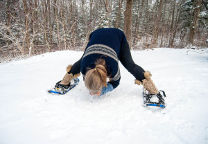 Wide forward fold: With feet turned slightly in and spread as wide as is comfortable, bend forward from the hips with a nice flat back. Depending on ability, you can place fingertips, palms or elbows on the ground.