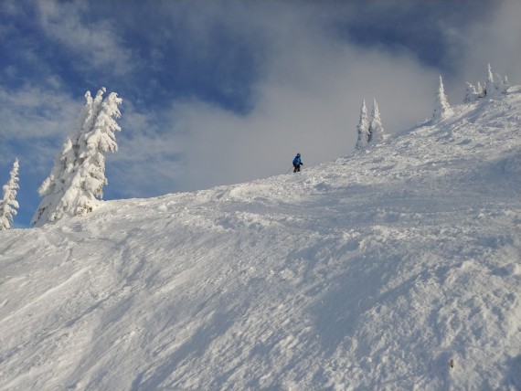 snowshoeing with a blue sky at Revelstoke Mountain Resort